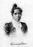 Ranavalona III (November 22, 1861 – May 23, 1917) was the last sovereign of the Kingdom of Madagascar. She ruled from July 30, 1883, to February 28, 1897, in a reign marked by ongoing and ultimately futile efforts to resist the colonial designs of the government of France. As a young woman, she was selected from among several andriana (nobles) qualified to succeed Queen Ranavalona II upon her death.<br/><br/>

Like both preceding queens, Ranavalona entered into a political marriage with a member of the Hova (freeman) elite named Rainilaiarivony who, in his role as Prime Minister of Madagascar, largely oversaw the day-to-day governance of the kingdom and managed its foreign affairs. Throughout her reign, Ranavalona utilized diverse tactics such as strengthening trade and diplomatic relations with the United States and Great Britain in the hope of staving off impending colonization. However, French attacks on coastal port towns and an assault on the capital city of Antananarivo ultimately led to the capture of the royal palace in 1896, thereby ending the sovereignty and political autonomy of the century-old kingdom.<br/><br/>

The newly installed French colonial government promptly exiled Rainilaiarivony to Algiers (in Algeria), while Ranavalona and her court were initially permitted to remain behind as symbolic figureheads. However, the outbreak of a popular resistance movement, called the Menalamba Rebellion, and discovery of anti-French political intrigues at court led the French to exile the queen to the island of Reunion in 1897. Rainilaiarivony died that same year and shortly thereafter Ranavalona, along with several members of her family, were relocated to a villa in Algiers. The queen, her family and the servants accompanying her were provided an allowance and enjoyed a comfortable standard of living including occasional trips to Paris for shopping and sightseeing.<br/><br/>

Despite Ranavalona's repeated requests, they were never permitted to return home to Madagascar. Ranavalona died of an embolism at her villa in Algiers in 1917 at the age of 55. Her remains were buried in Algiers but were disinterred 21 years later and shipped to Madagascar, where they were placed within the tomb of Queen Rasoherina on the grounds of the Rova of Antananarivo.